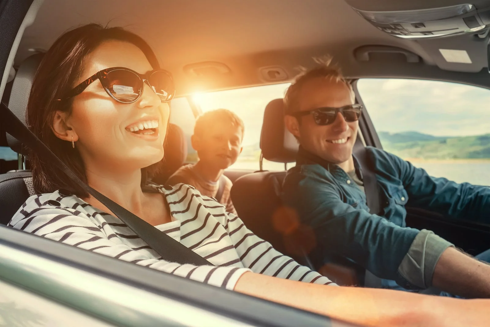 auto_insurance family in car smiling